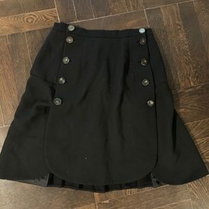 Black mini skirt with buttons and pleats